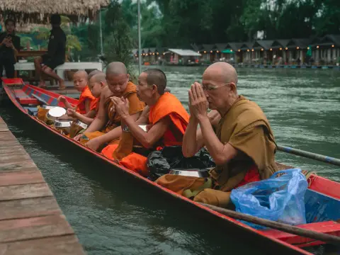 Experiencing the Serenity of Alms Giving Ceremony (Tak Bat) by Boat in Meuang Feuang