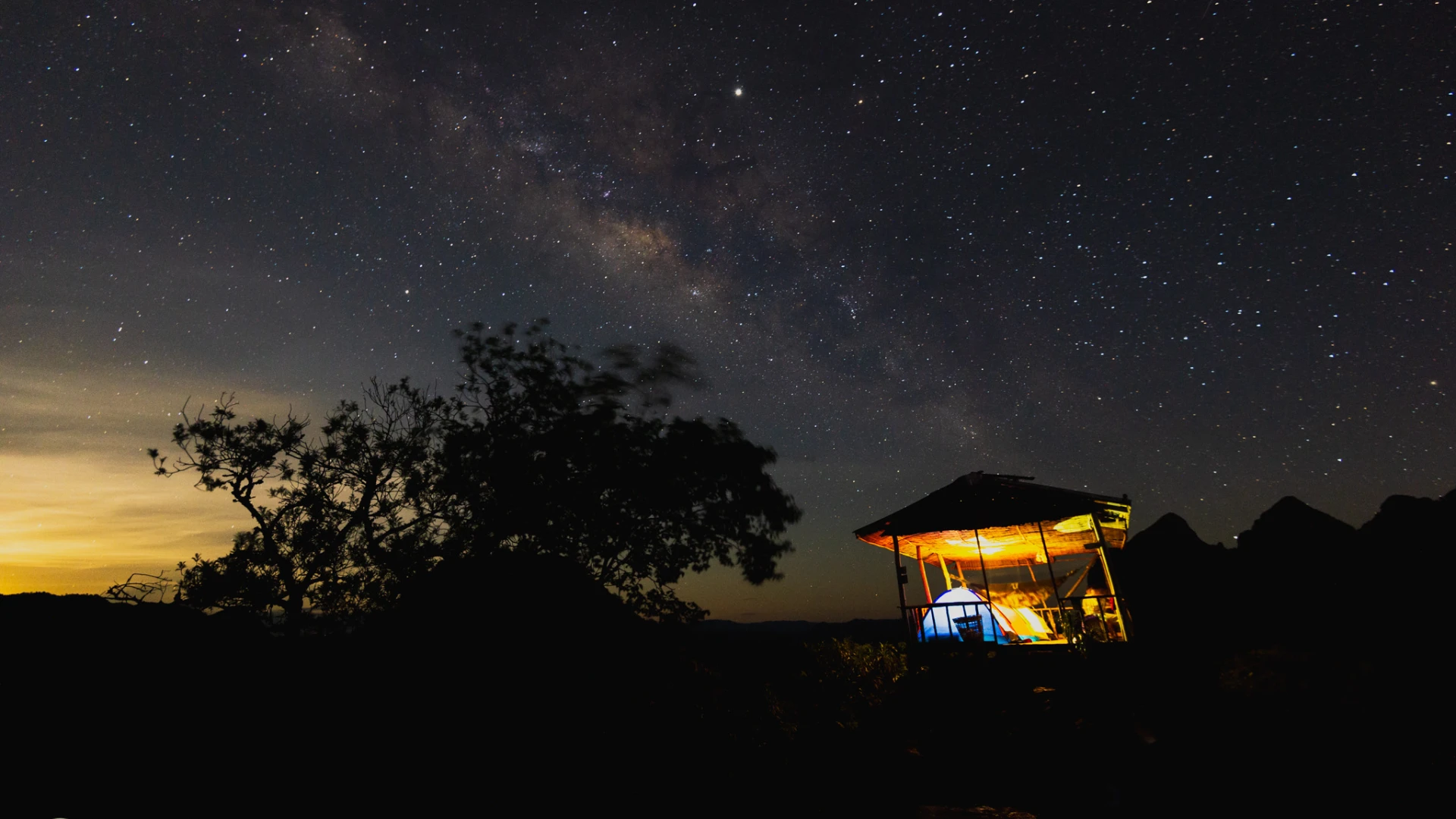 Pha Daeng Viewpoint in Nong Khiaw at night with the milky way.